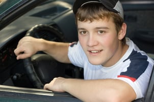 Teenager behind the wheel of his first car