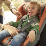 We can feel like a bad mom when our child cries, like the boy crying in this carseat..