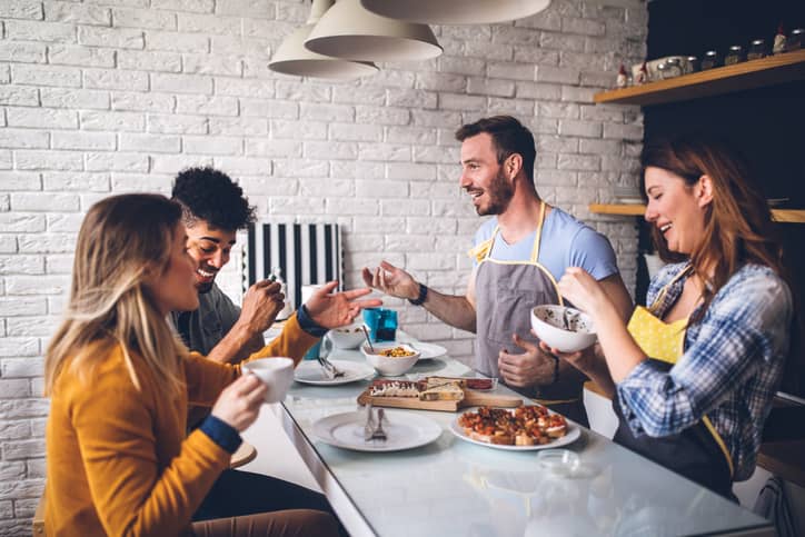 A group having dinner together and socializing; good for brain health