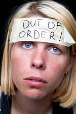 A young woman wearing an out-of-order sticker on her forehead signifying unhealthy bottled emotions.