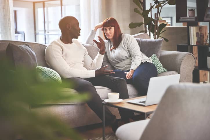 A-couple-talking-on-the-sofa-at-home.-A-young-man-and-woman-having-a-serious-discussion-on-the-couch-1398737196_726x484_Compressed