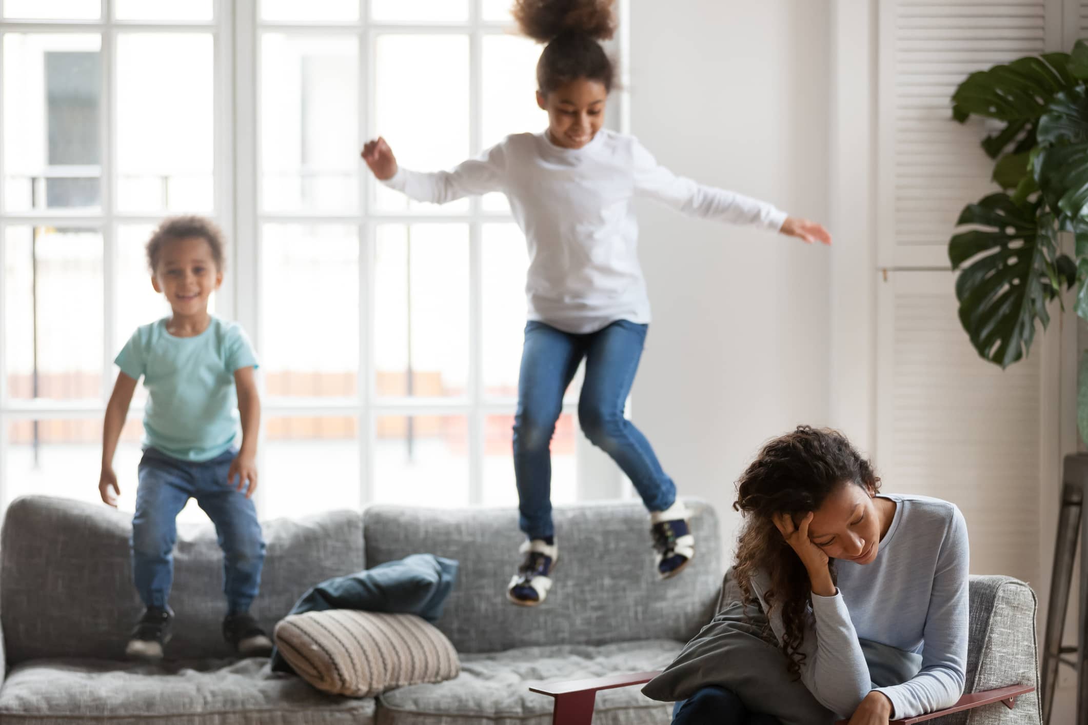 Exhausted mom ignoring misbehavior