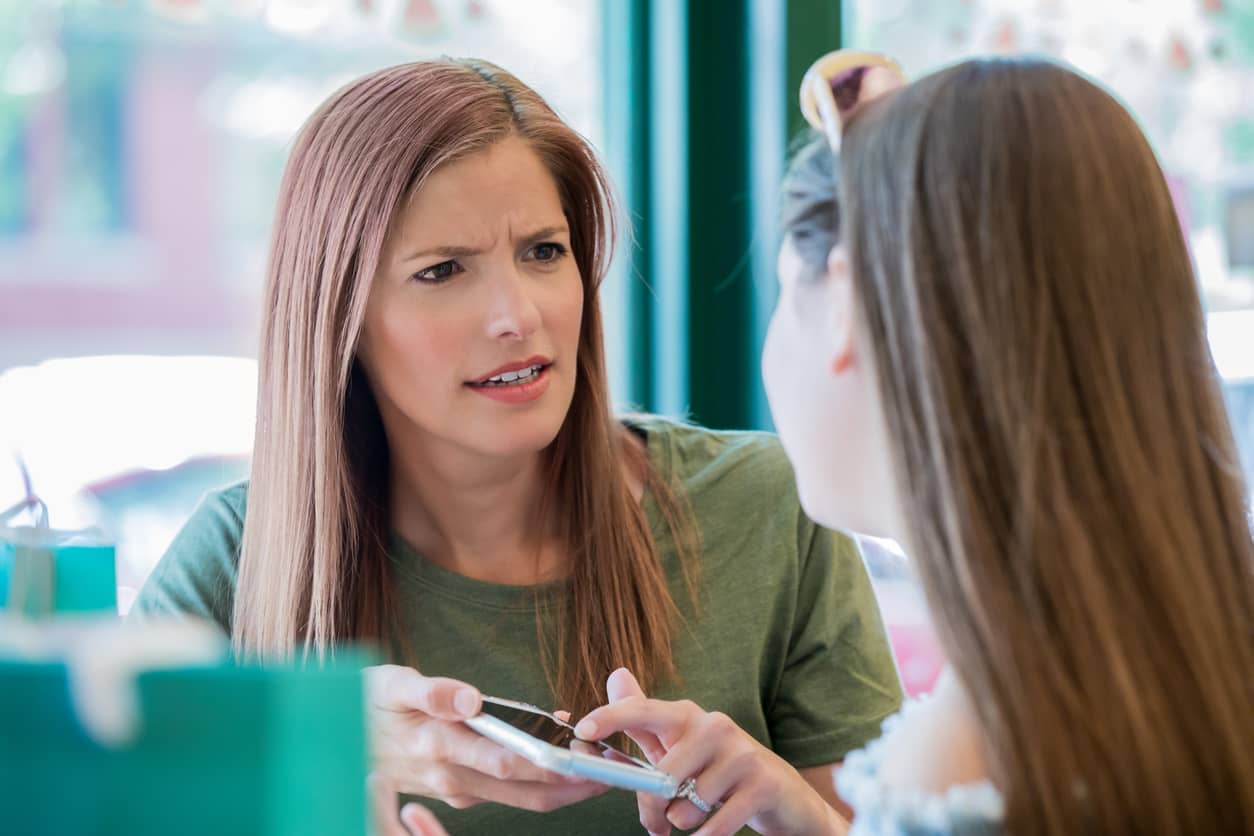 An angry mother who is chastising her teenage daughter.