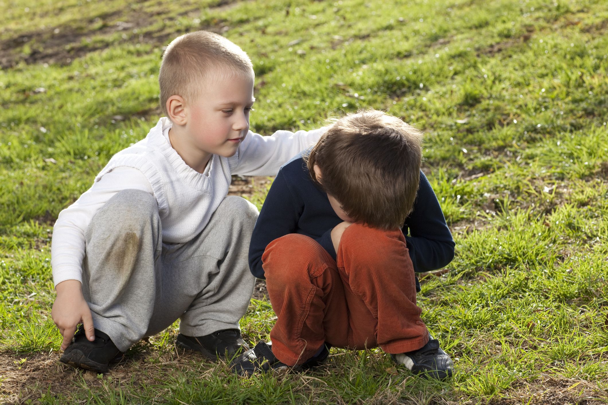 A young boy expressing empathy for his friend.