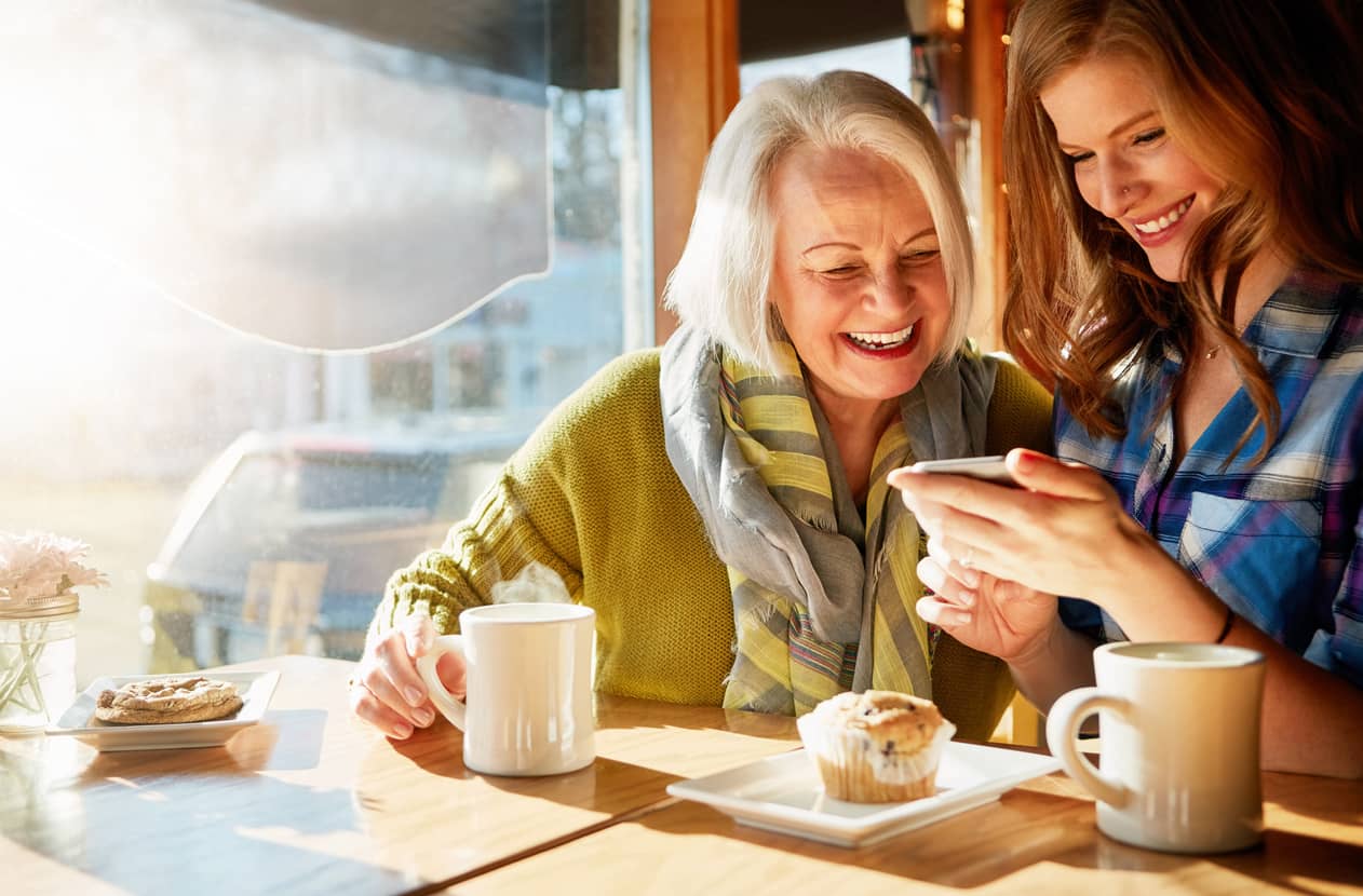 Mother and daughter watching a video on a phone