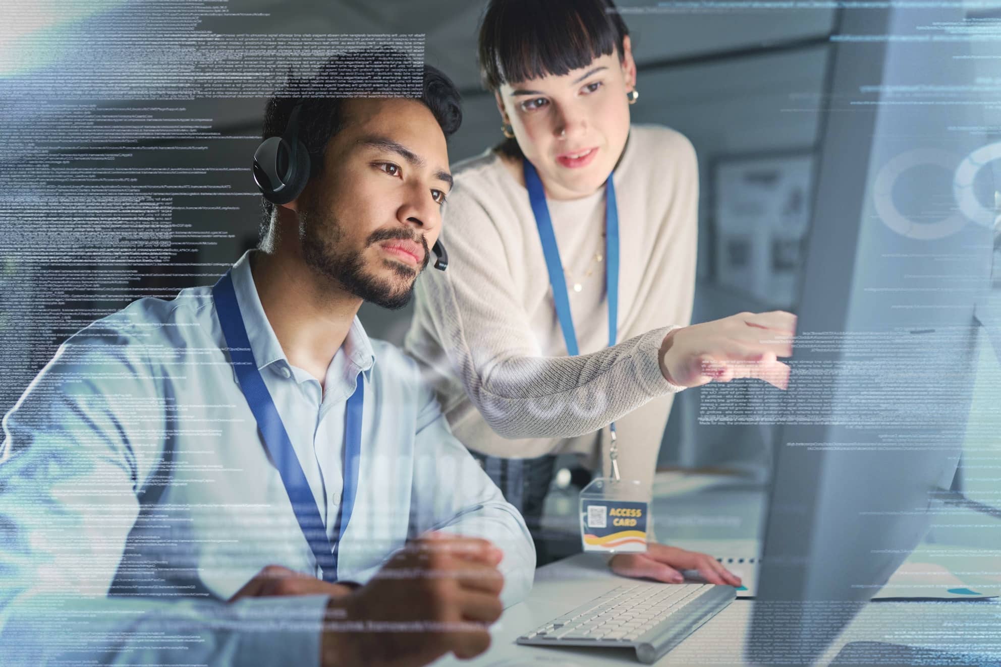Call center with an empathetic leader coaching an employee with a digital overlay.
