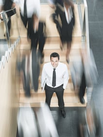 Businessman standing in the middle of diversity