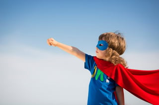 Child pretending to be superman