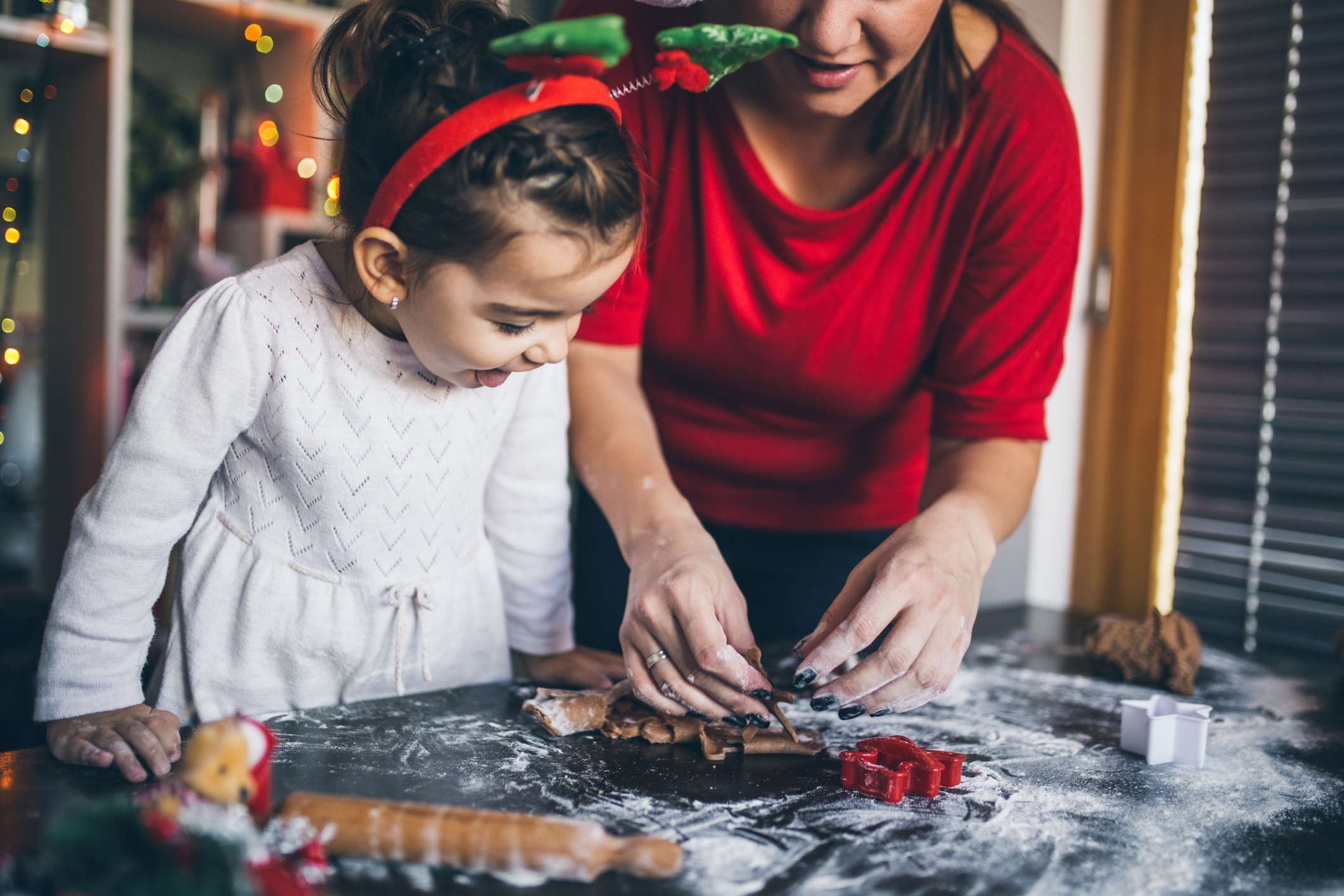 A mother and daughter making Christmas cookies together