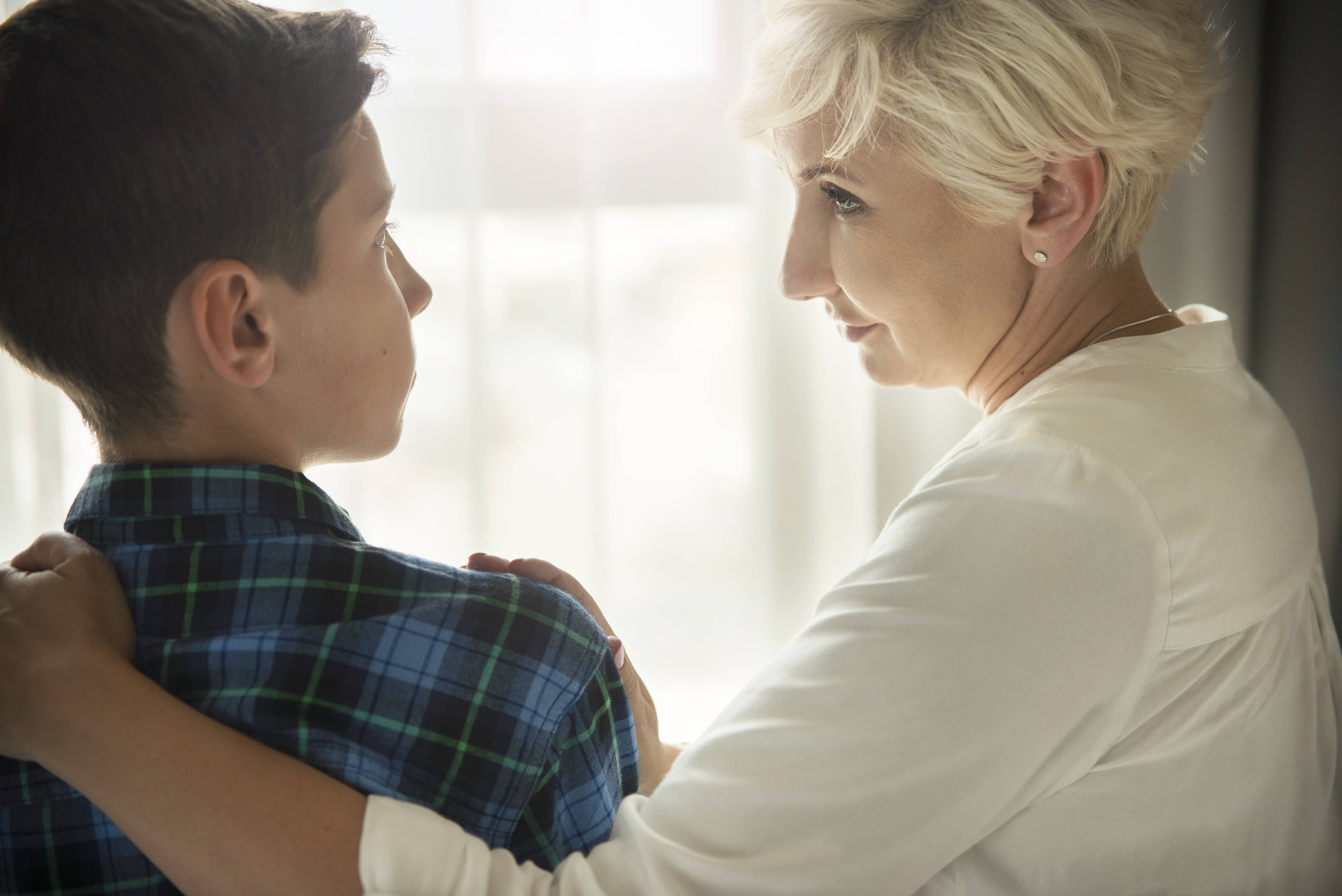 Compassionate mother talking with her son