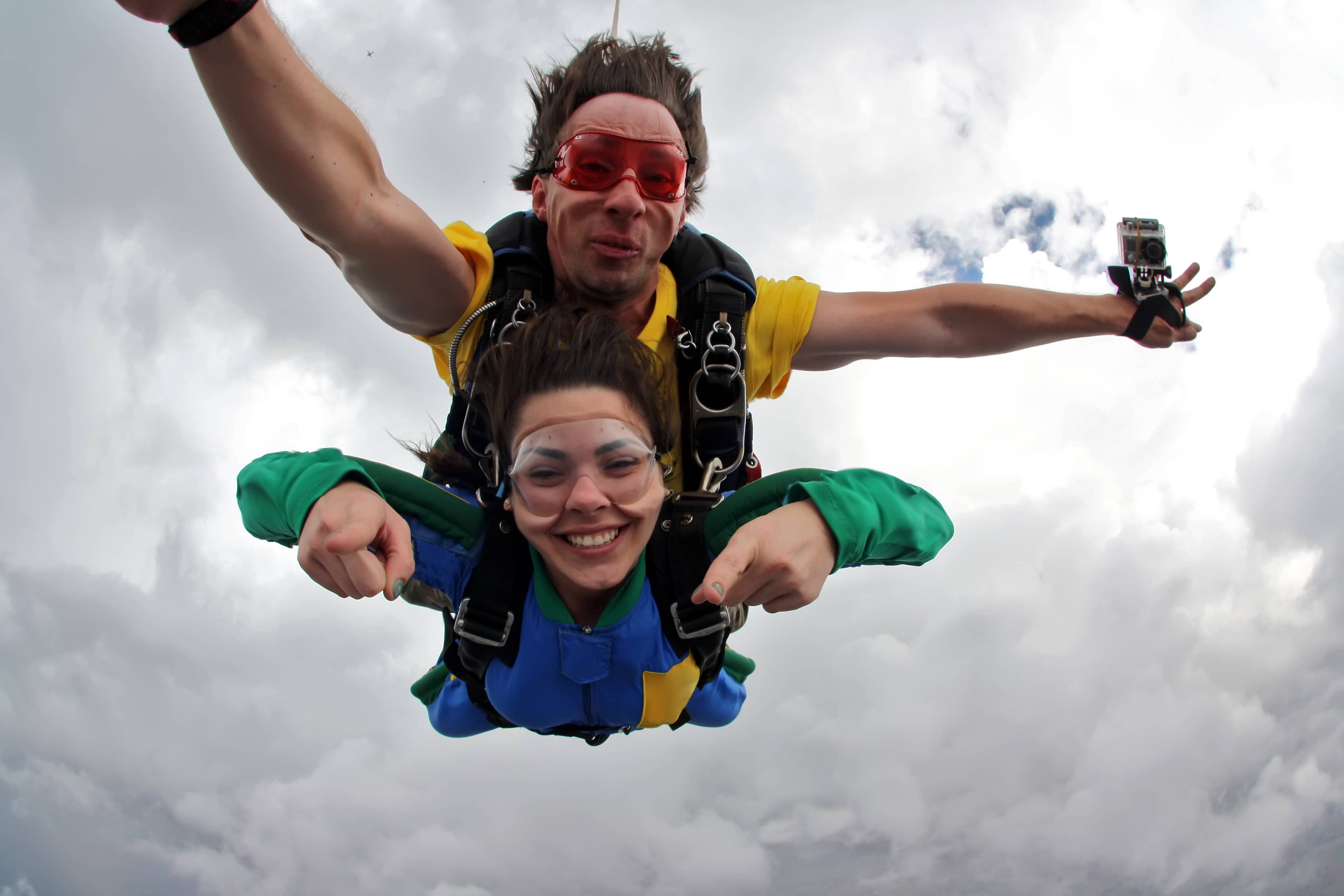 A couple getting a dose of adrenaline through skydiving.