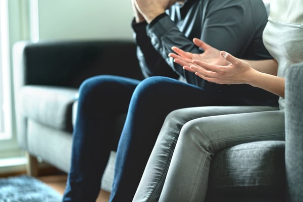 A reactive couple fighting on the couch