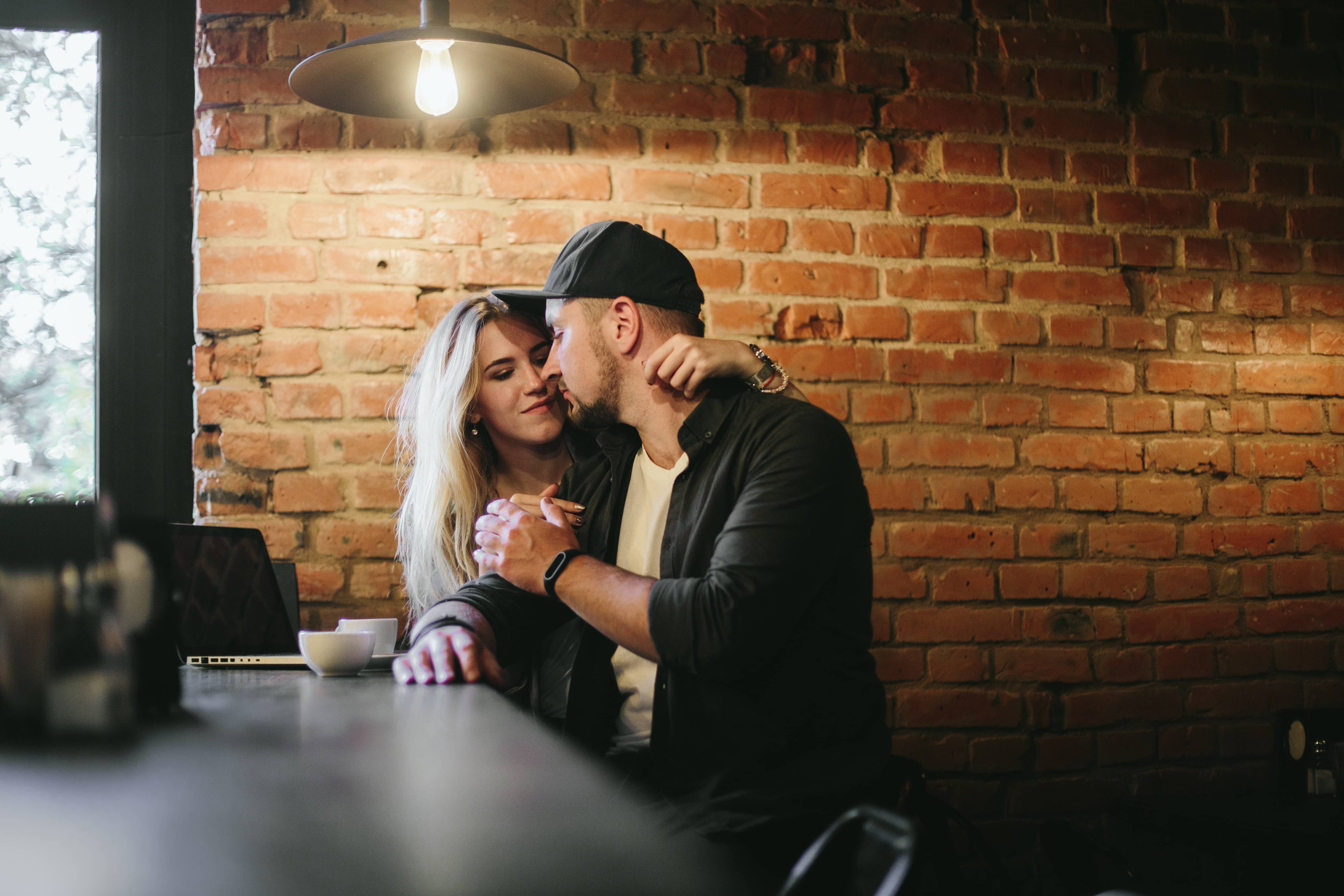 Romantic couple leaning into each other