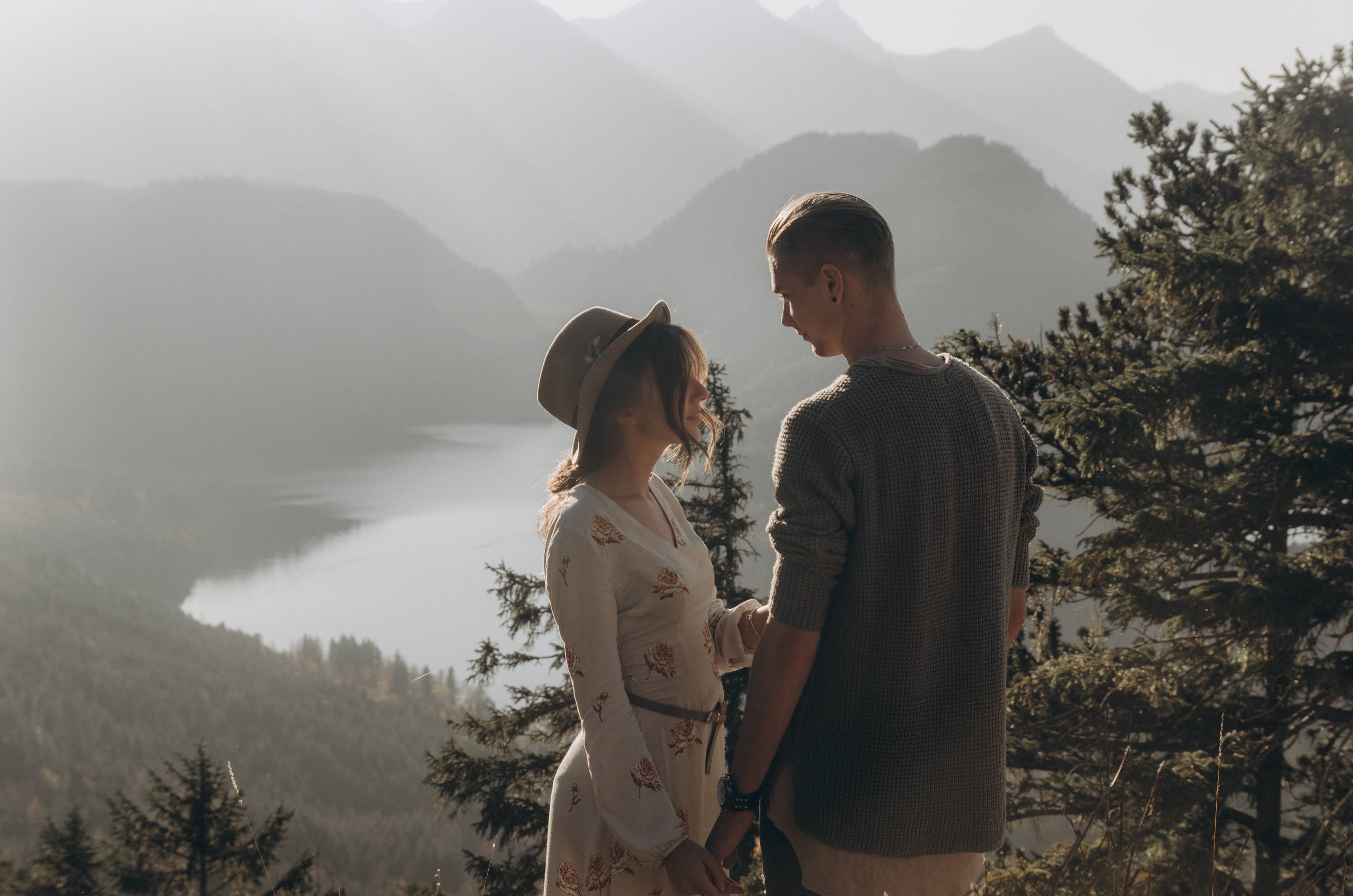 Mountaintop elopement with a romantic couple standing on a mountaintop.