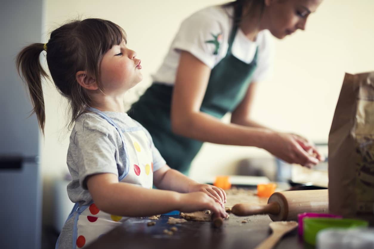 Stay-at-home mom baking with preschooler 