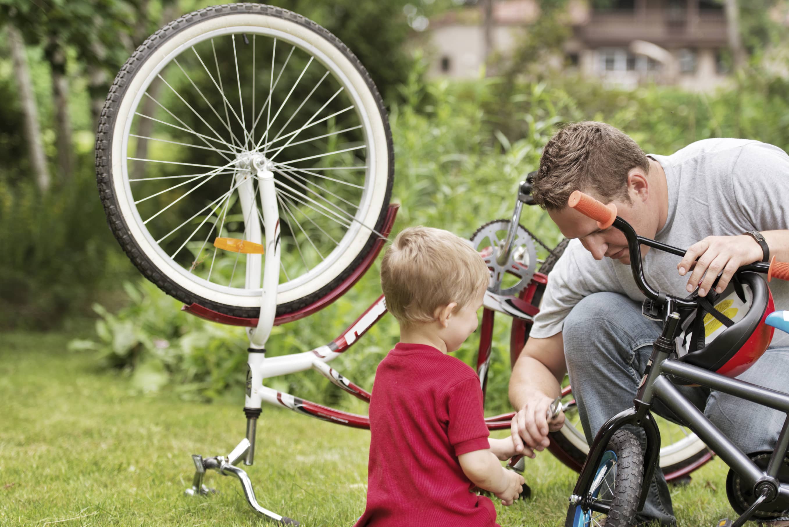 Father and son repairing a bicycle