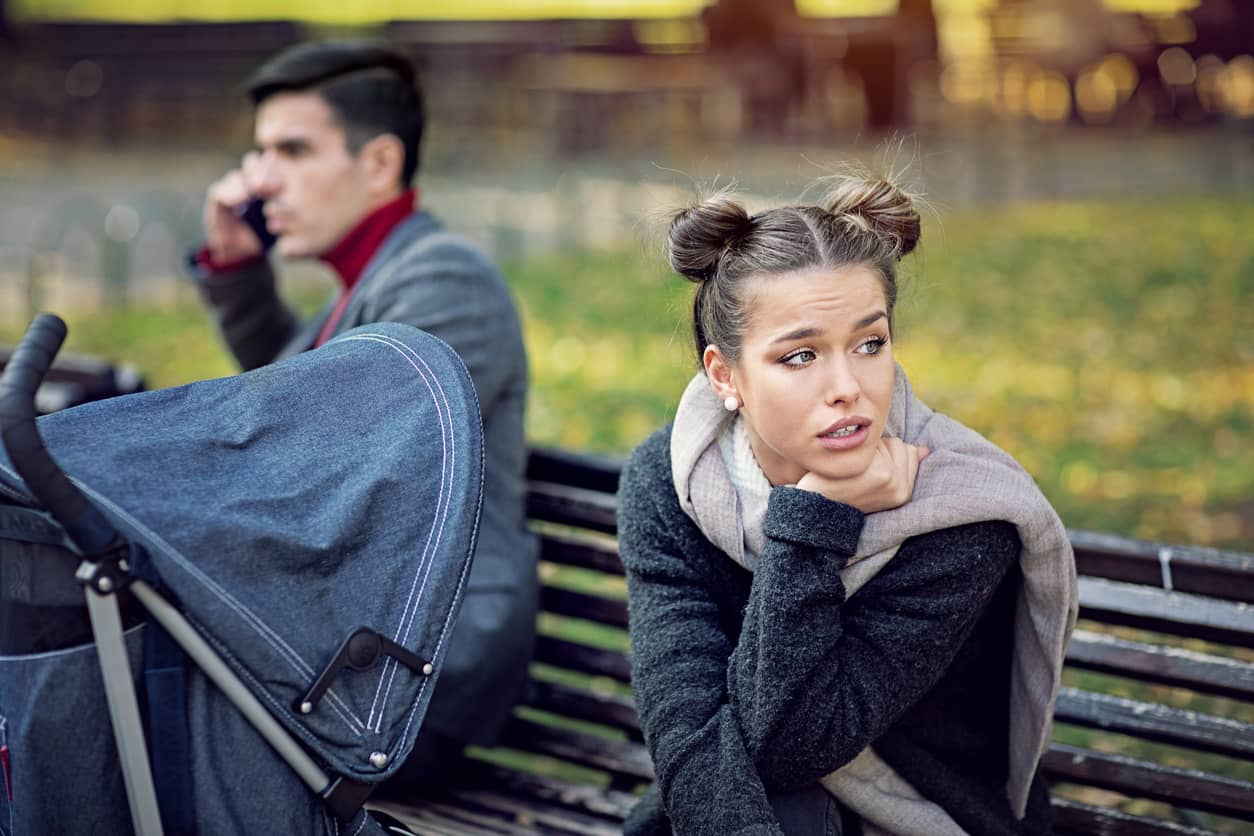 Frustrated spouse whose husband is talking on his iPhone