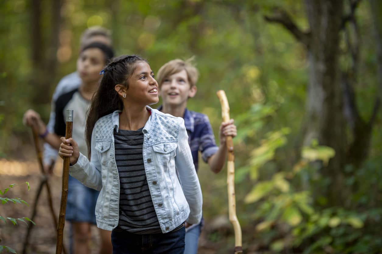 Elementary kids hiking; exercise is great for emotional regulation