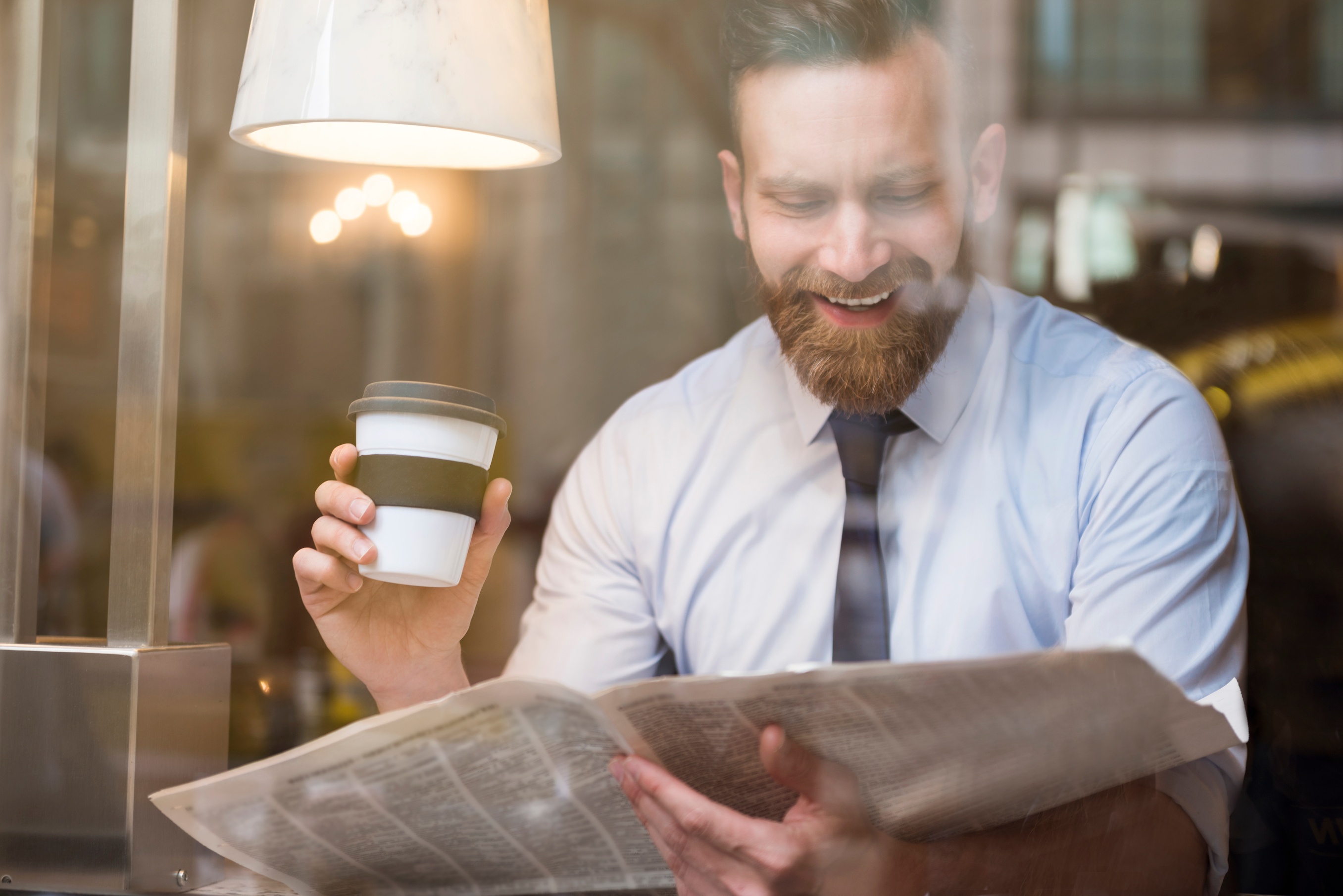 Reading the newspaper or ignoring his wife?