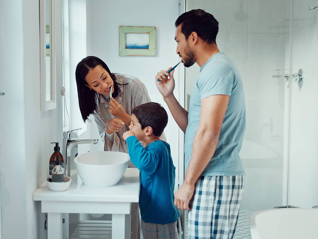 A family brushing their teeth together as a new micro-novelty ritual..