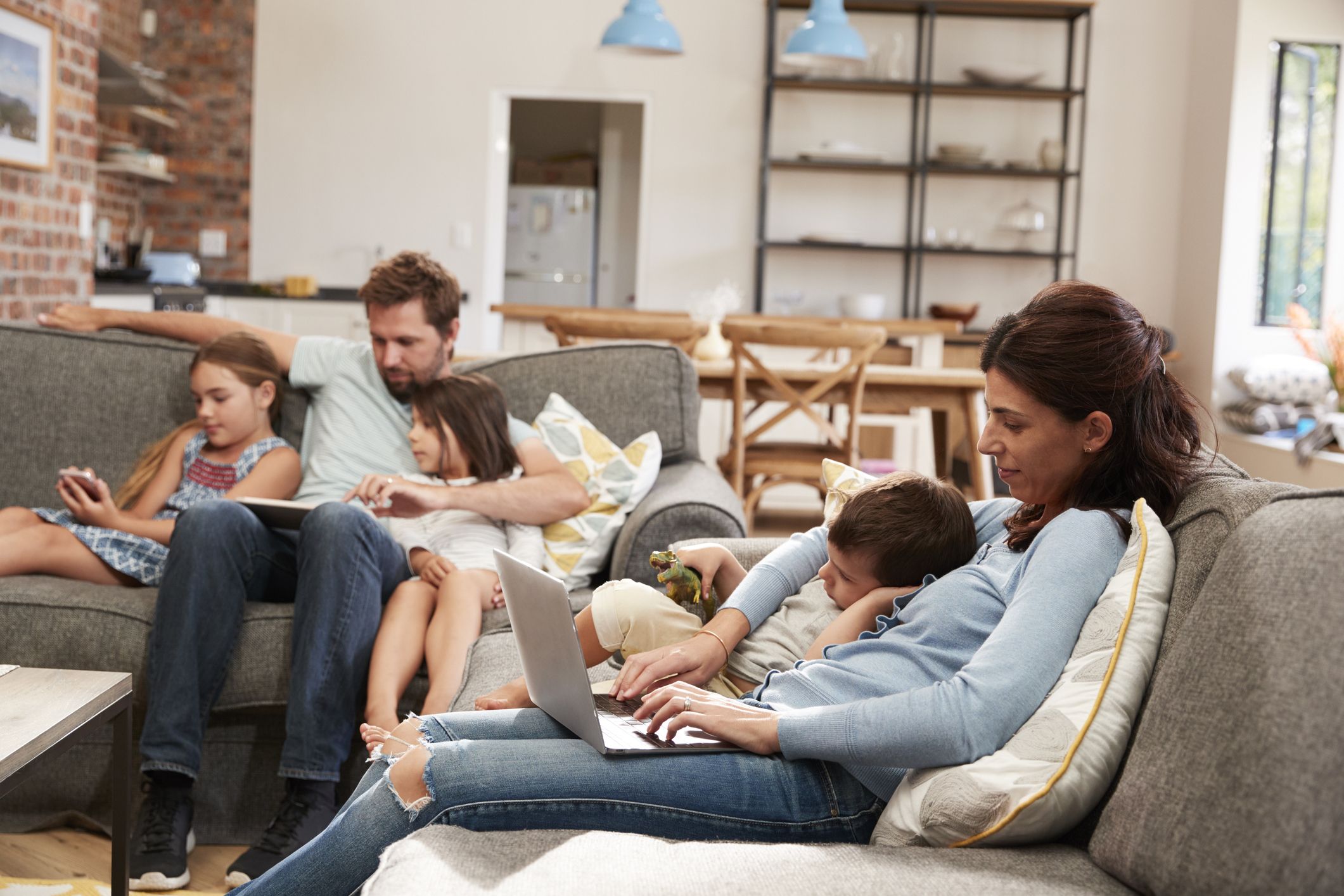 A family together but everyone is on a screen