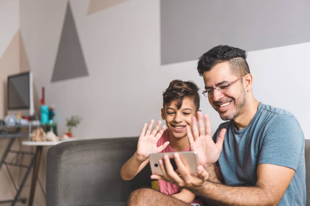 Father and son video chatting to stay connected