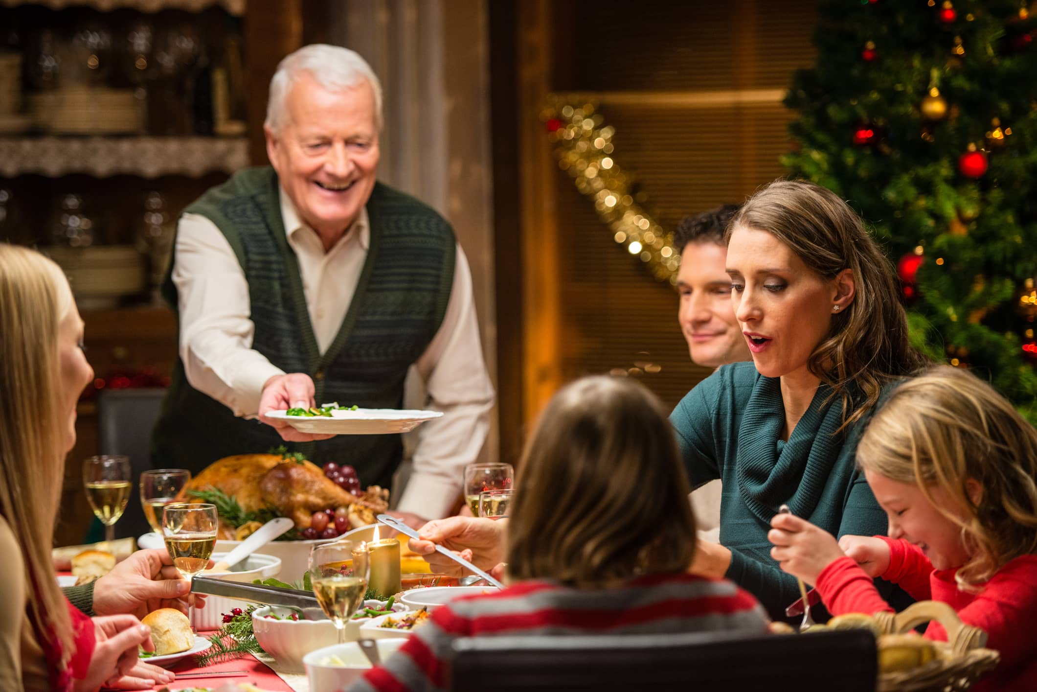 A blended family celebrating a Christmas dinner