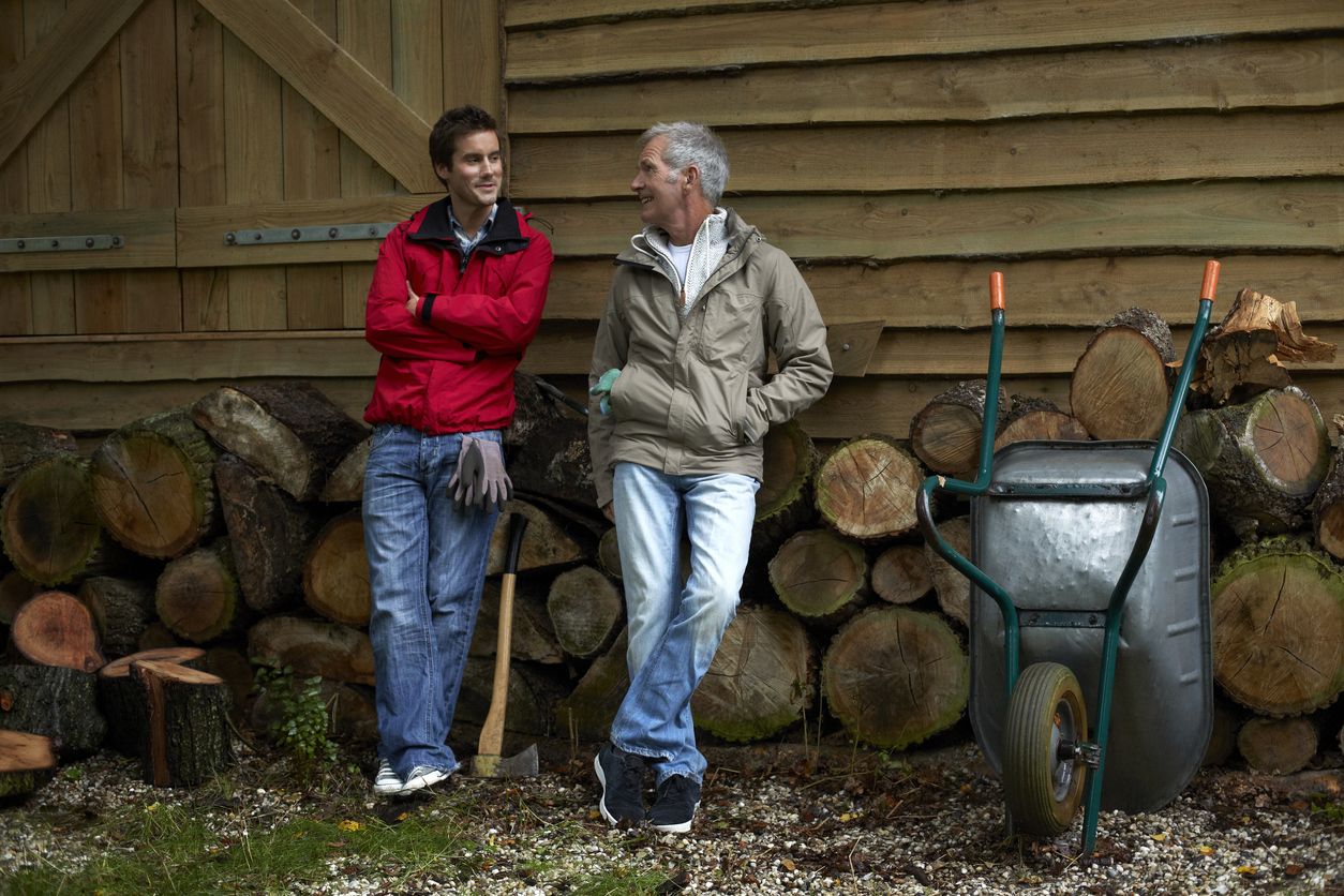 Two men recreating at a cabin in the woods