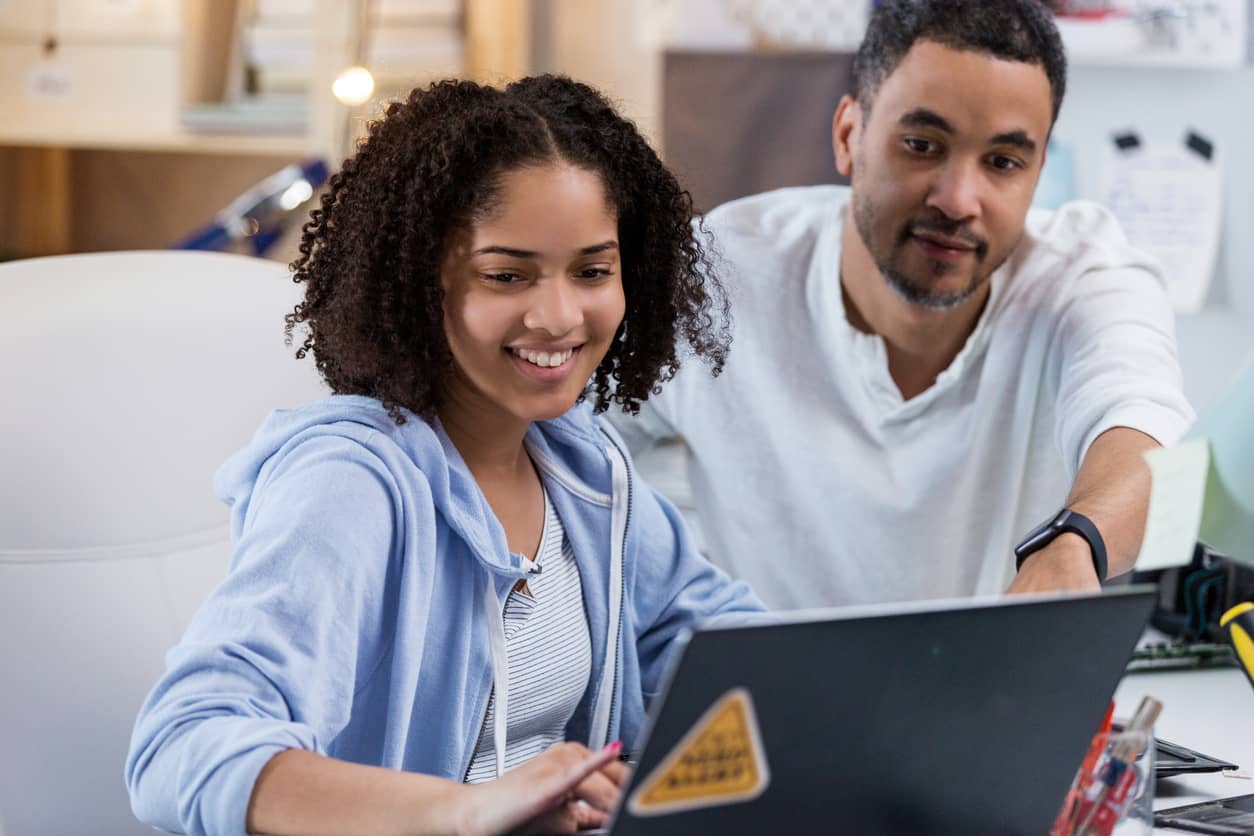 Father showing his daughter a healthy use of technology.