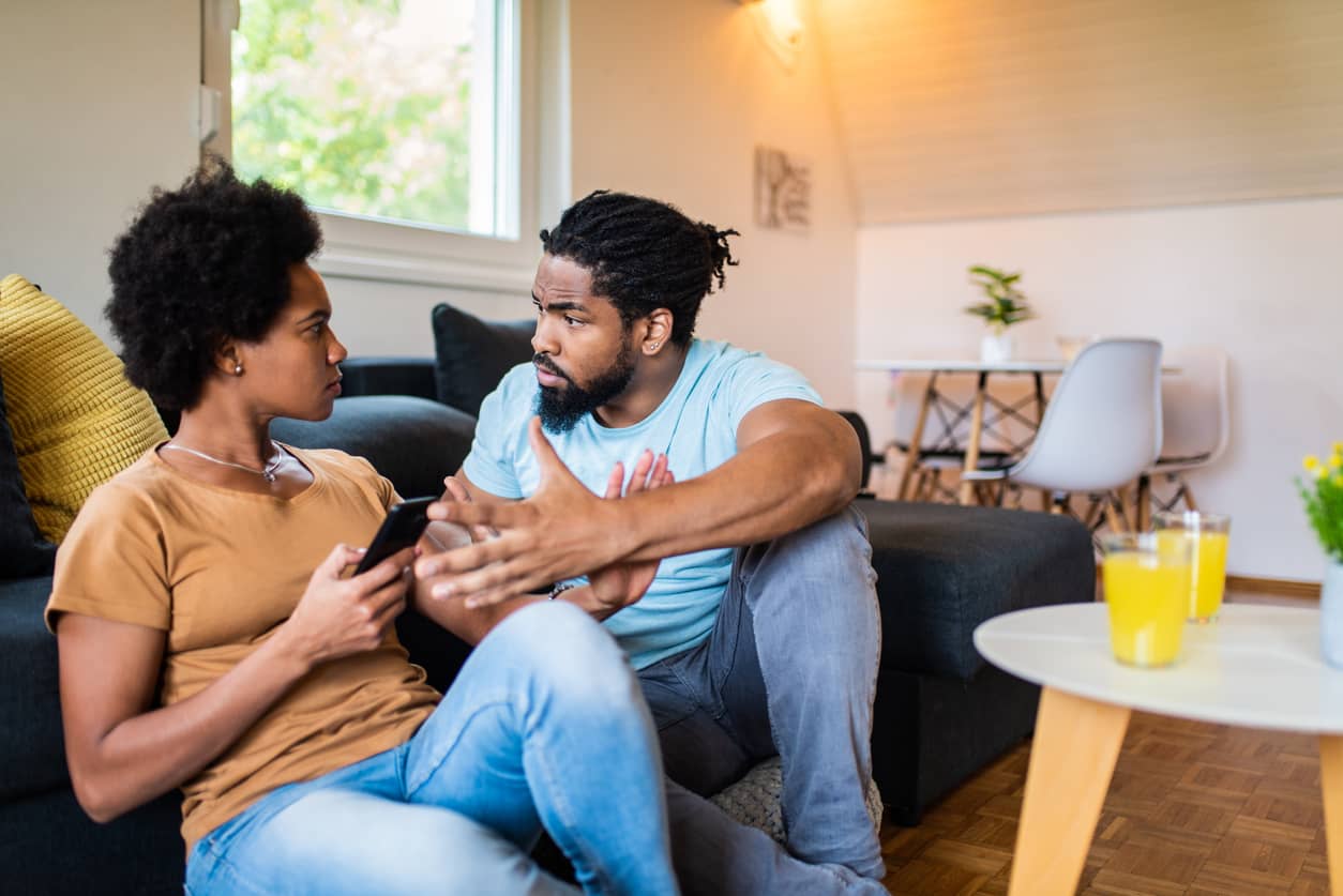 Frustrated black couple arguing and making emotional withdrawals