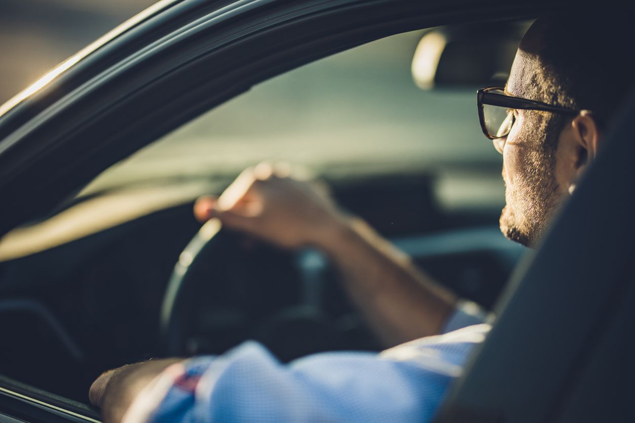 Man driving to work while setting a positive intention