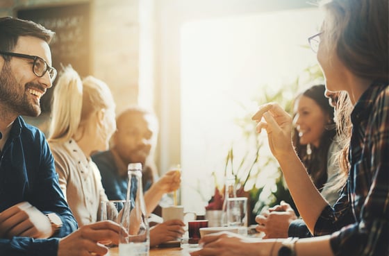 Friends at restaurant in conversation