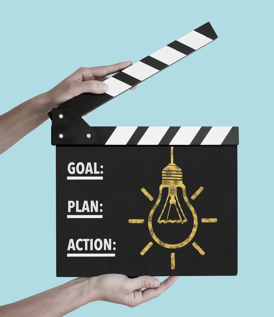 Clapper board saying GOAL, PLAN, ACTION.