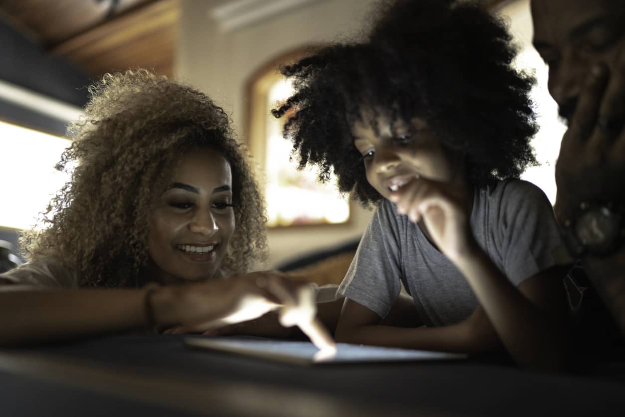 Mother and daughter with EQ enjoying a chat on their tablet