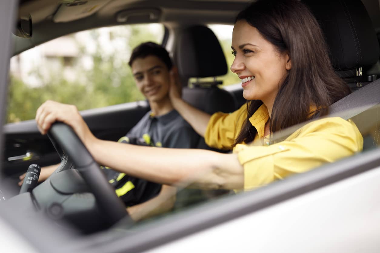 A mother and her teenage son in a car having a meaningful conversation