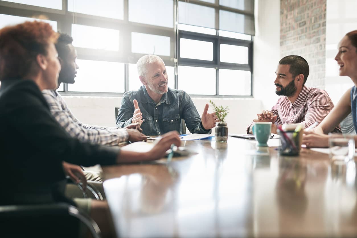 An emotionally intelligent leader conducting a training with his employees.