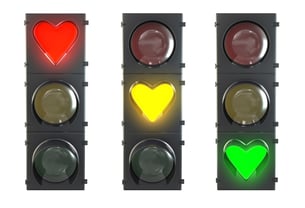 Heart stoplights in red, yellow, and green representing flow in relationships.