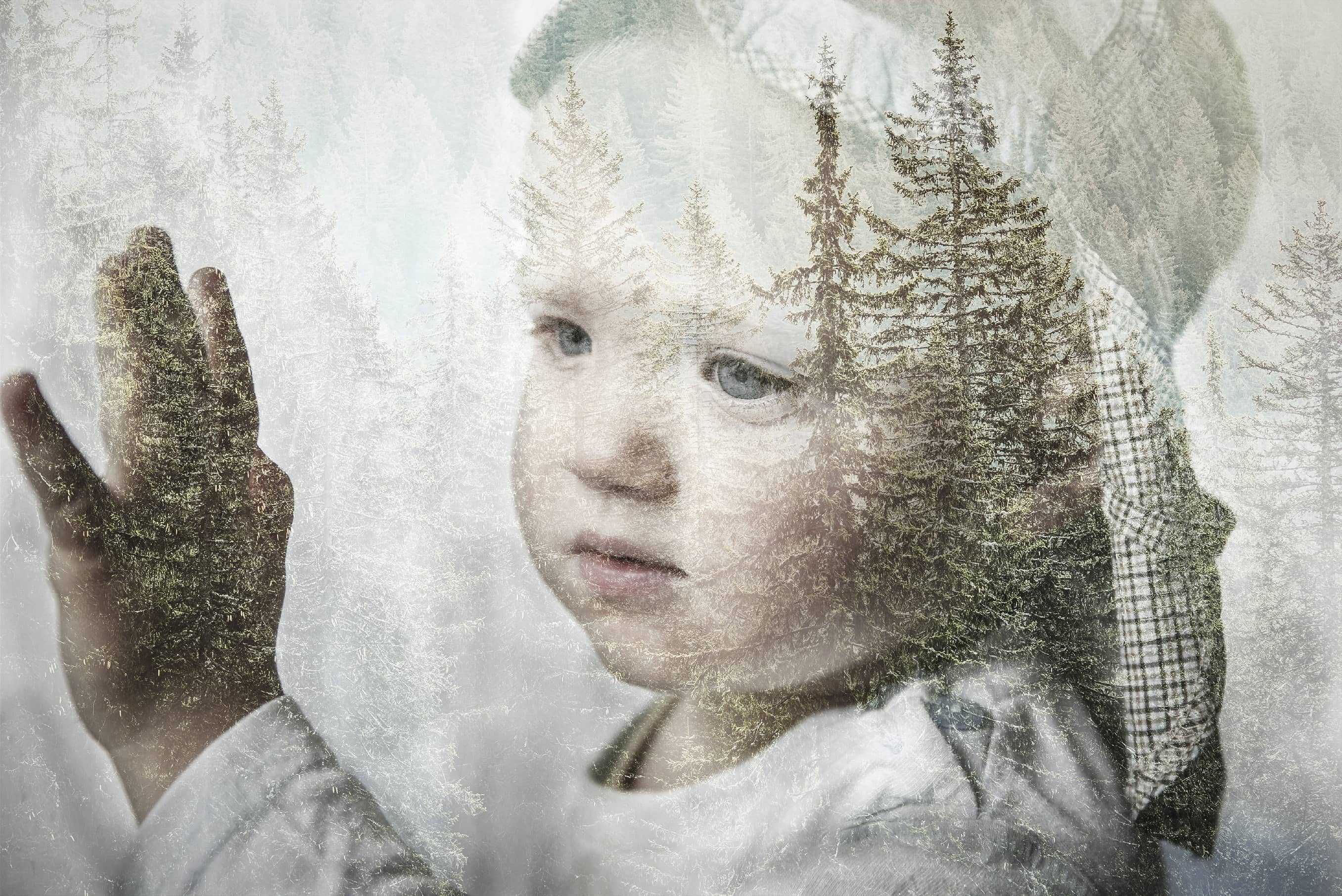 Little nature-deprived boy with hand on window longing for nature