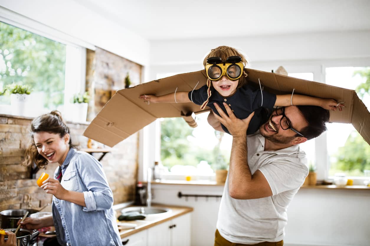 Look daddy I'm an airplane! Dad creating playtime and fun.