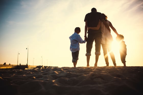 Loving family at the beach spending time together