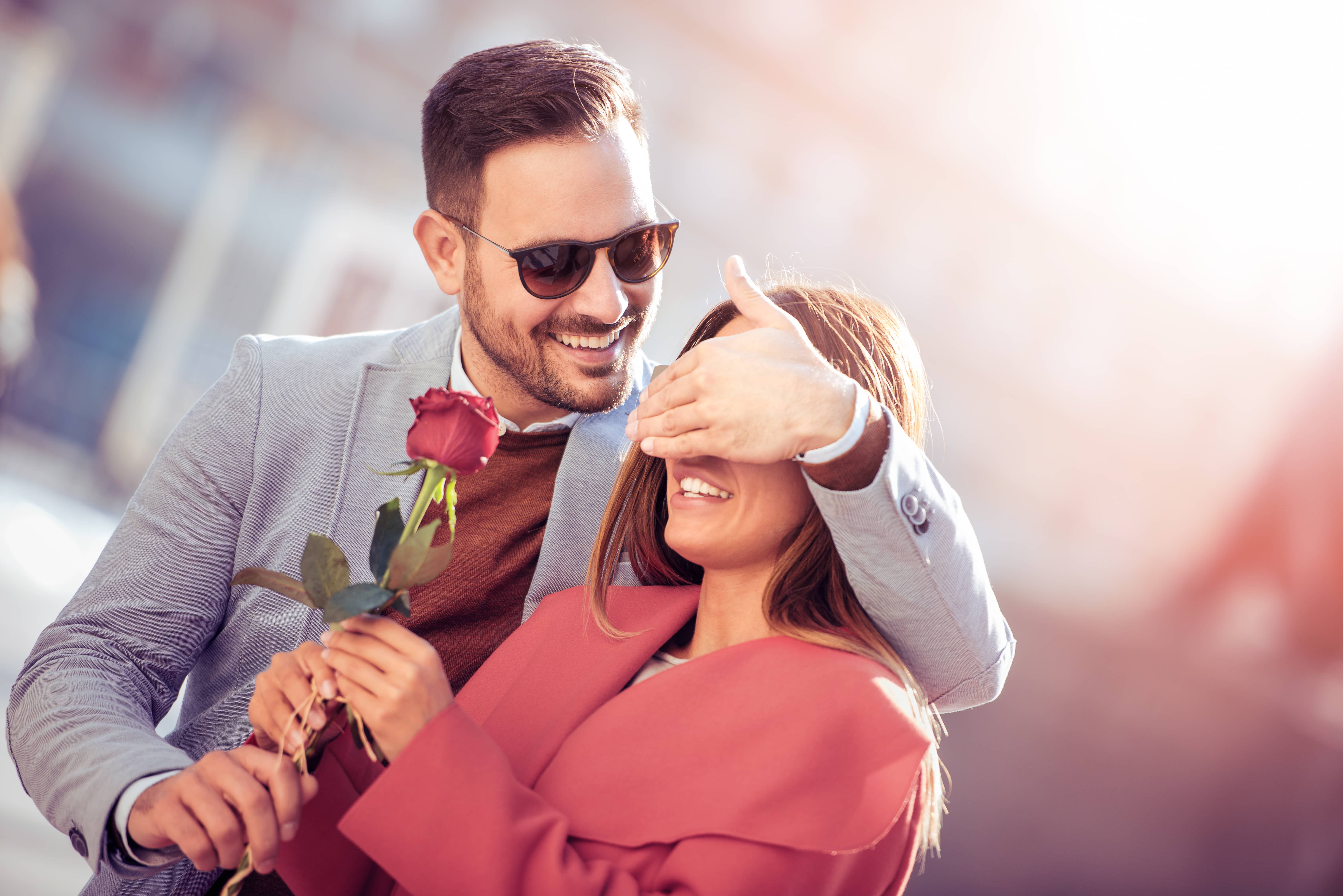 Husband giving his lovely wife a rose