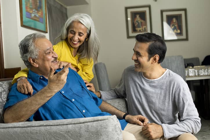 Grown child spending time with his parents.