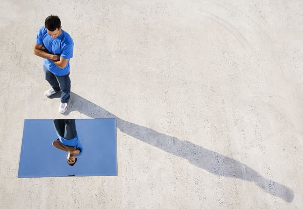 A man sees his reflection in the mirror of empathy