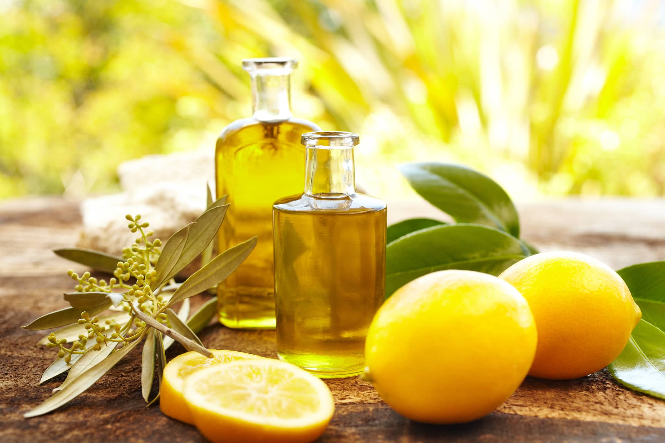 Massage oil bottles at a spa with lemons and lemon essential oils.
