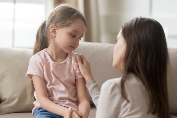 A mother comforting her daughter with empathy