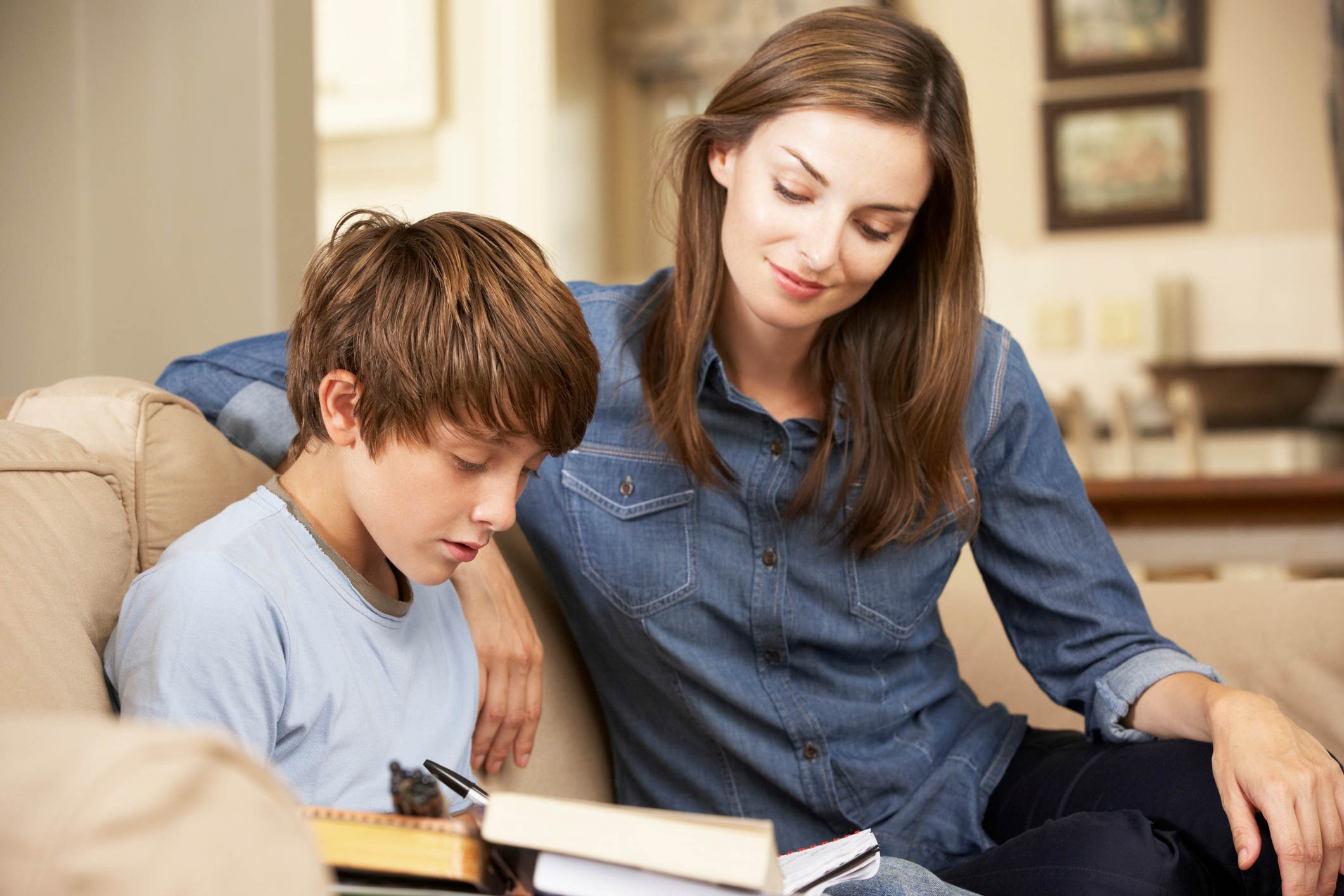 Mother encouraging her son with his homework