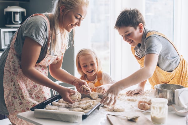 Mother and children baking in the kitchen