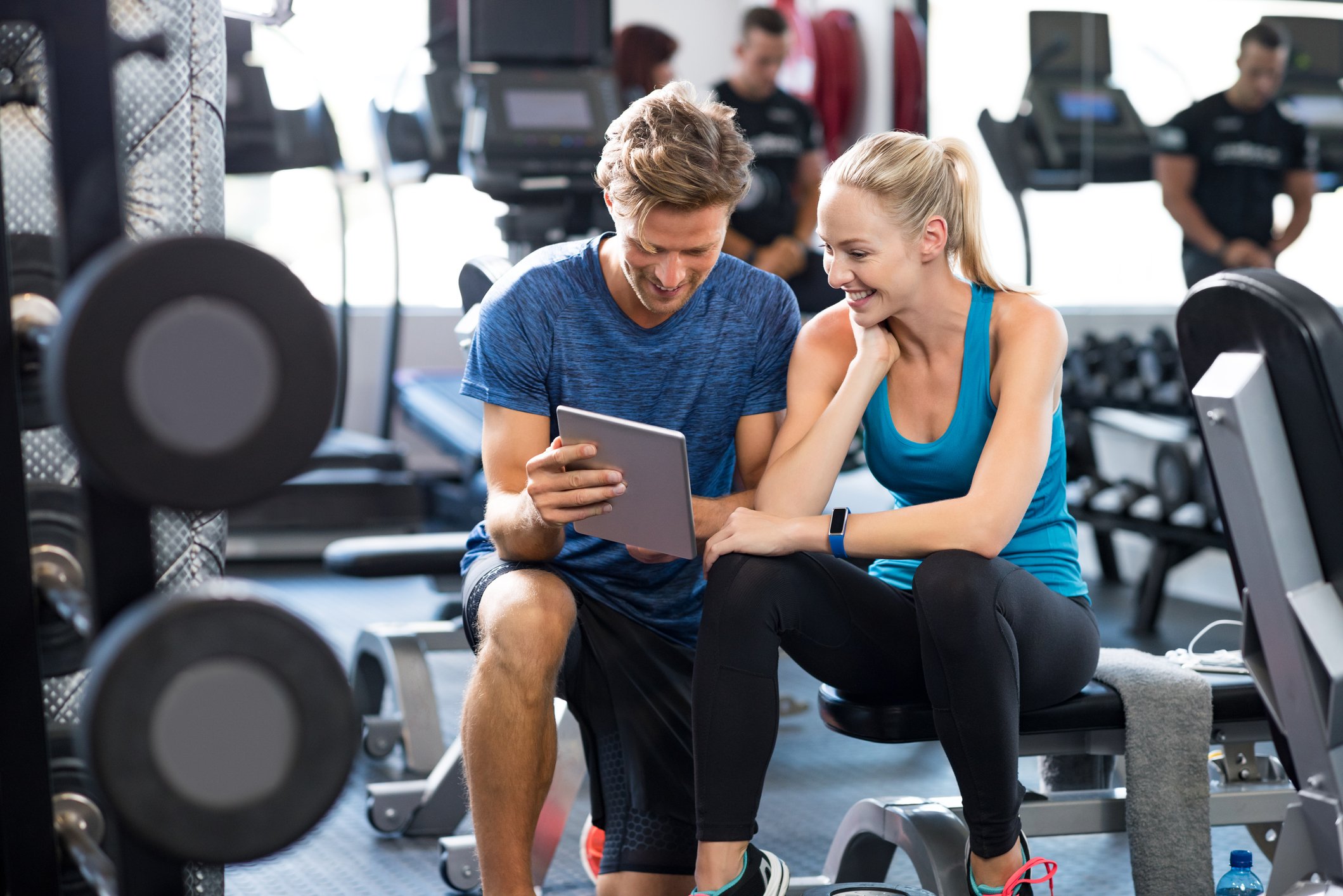 Personal trainer supporting a woman to make positive change