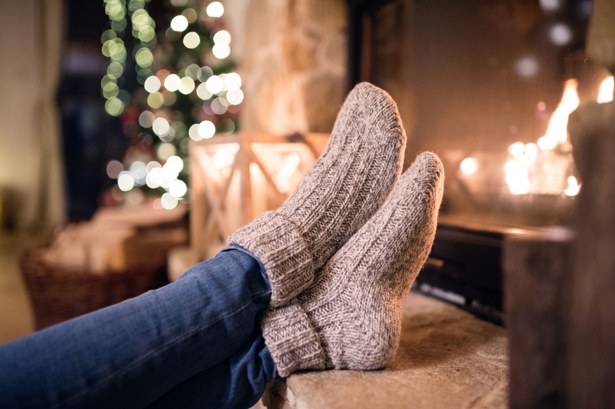 Sitting by a cozy fire taking a self-care moment