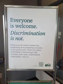 REI sign about inclusivity and acceptance.